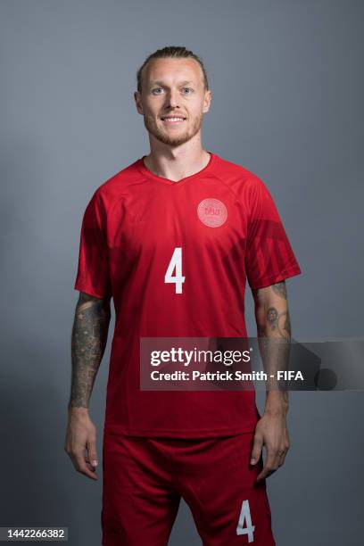 Simon Kjaer of Denmark poses during the official FIFA World Cup Qatar 2022 portrait session on November 17, 2022 in Doha, Qatar.