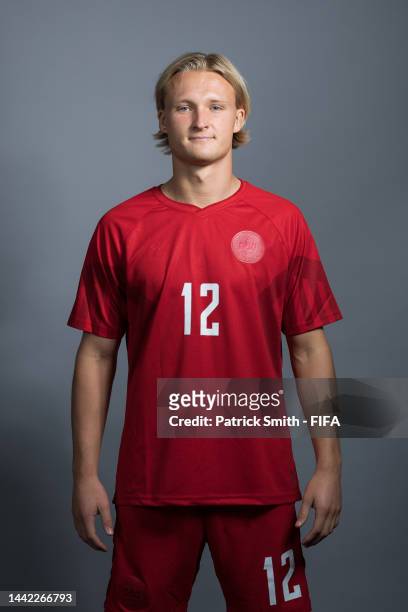 Kasper Dolberg of Denmark poses during the official FIFA World Cup Qatar 2022 portrait session on November 17, 2022 in Doha, Qatar.