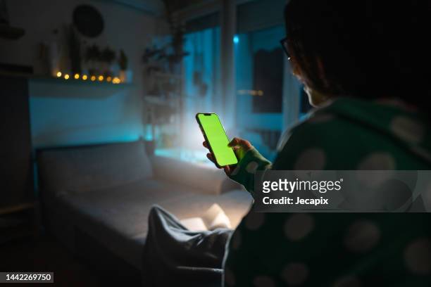 using phone in dark room - internet outage stock pictures, royalty-free photos & images