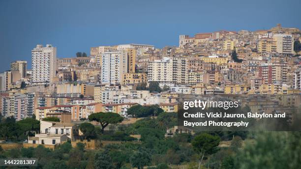 looking out at the hill town of agrigento in sicily - agrigento stock pictures, royalty-free photos & images