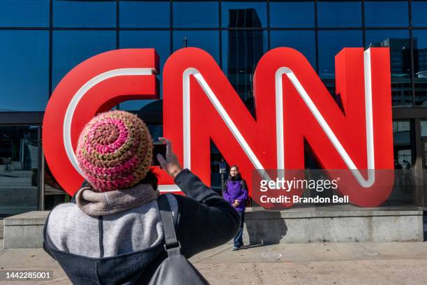 People take pictures outside of the world headquarters for the Cable News Network on November 17, 2022 in Atlanta, Georgia. CNN's CEO and Chairman,...