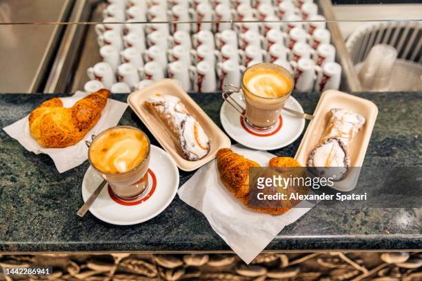 coffee and sweet pastries served in traditional roman cafe, italy - roma capucino stock pictures, royalty-free photos & images