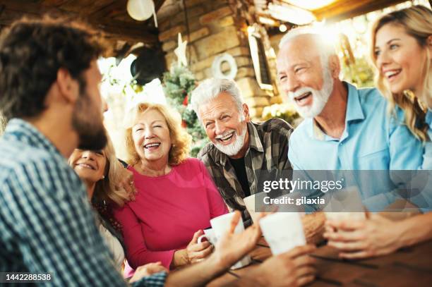 family gathering on christmas eve. - old man woman christmas stock pictures, royalty-free photos & images