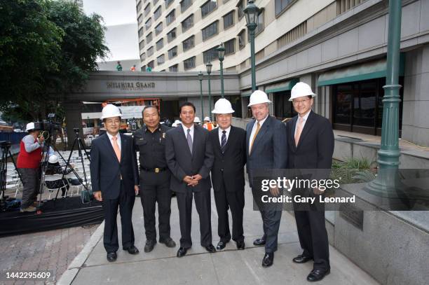 Outside the old Wilshire Grand City Council Member José Huizar poses for a group portrait with the Hanjin Group owners and CJ Martin construction...