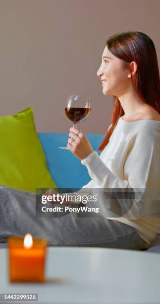 asian woman enjoying wine - avoidance stock pictures, royalty-free photos & images