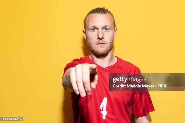 Simon Kjaer of Denmark poses during the official FIFA World Cup Qatar 2022 portrait session on November 17, 2022 in Doha, Qatar.