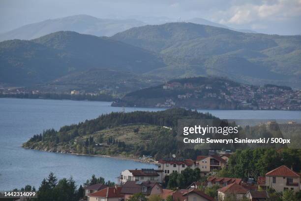 high angle view of townscape by sea against sky,ohrid,macedonia - ohrid stock pictures, royalty-free photos & images