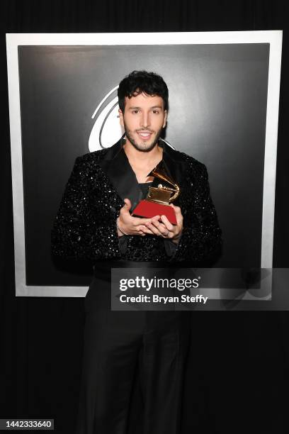 Sebastián Yatra poses backstage with the award for Pop Song - Songwriters for “Tacones Rojos” during the Premiere Ceremony for The 23rd Annual Latin...