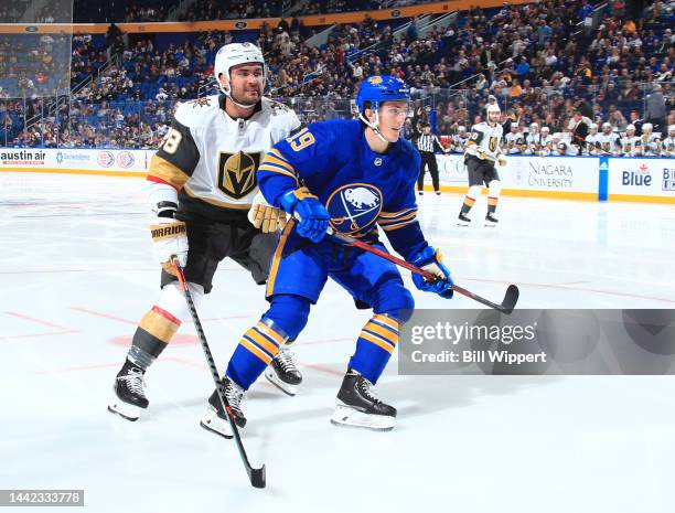 Peyton Krebs of the Buffalo Sabres is defended by William Carrier of the Vegas Golden Knights during an NHL game on November 10, 2022 at KeyBank...
