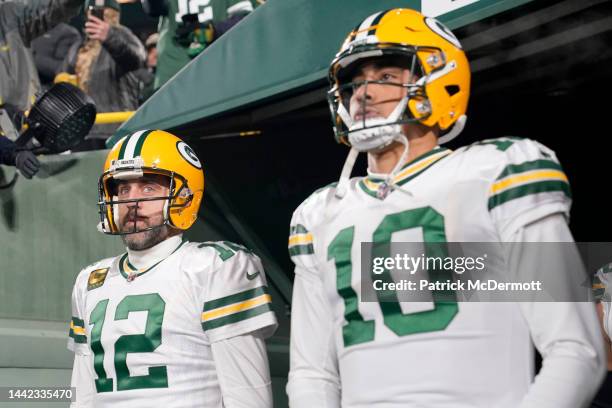 Aaron Rodgers and Jordan Love of the Green Bay Packers look on prior to the game against the Tennessee Titans at Lambeau Field on November 17, 2022...