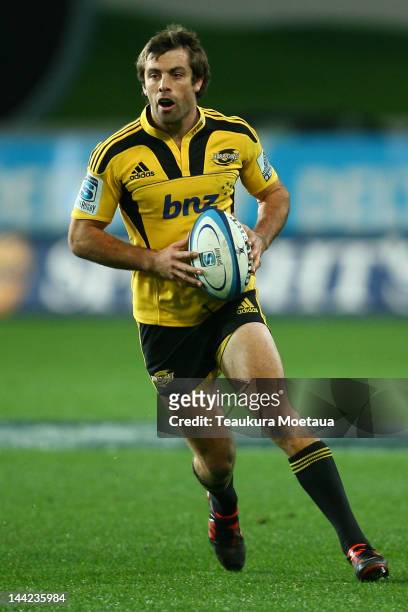 Conrad Smith of the Hurricanes makes a break during the round 12 Super Rugby match between the Highlanders and the Hurricanes at Forsyth Barr Stadium...