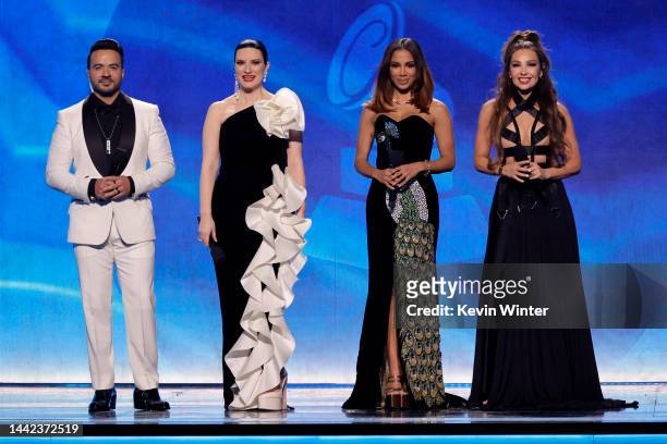 Co-hosts Luis Fonsi, Laura Pausini, Anitta, and Thalía speak onstage during The 23rd Annual Latin Grammy Awards at Michelob ULTRA Arena on November...