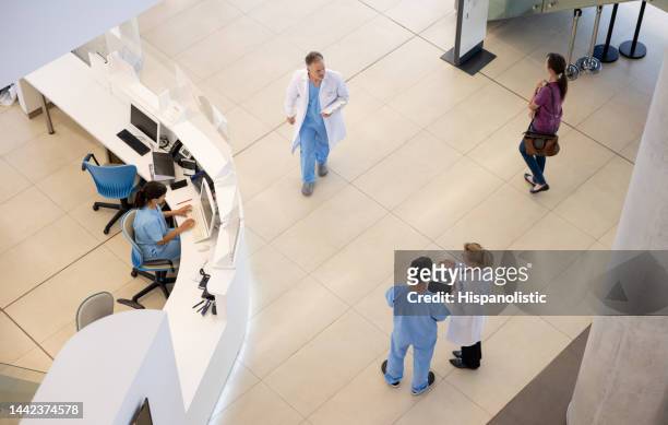 doctors and nurses working at the hospital - hospice stock pictures, royalty-free photos & images