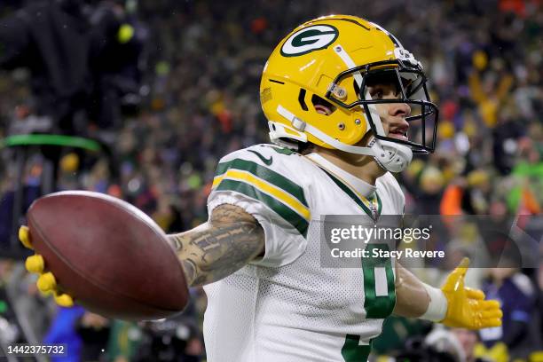 Christian Watson of the Green Bay Packers celebrates after scoring a touchdown against the Tennessee Titans during the third quarter in the game at...