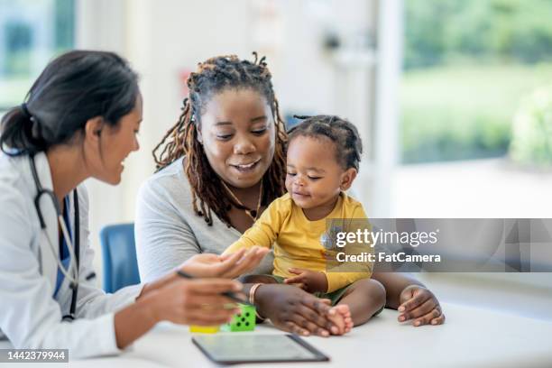 family medical appointment - family medicine stock pictures, royalty-free photos & images