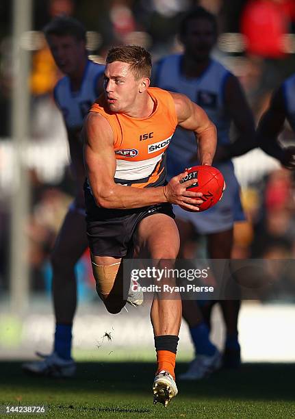 Devon Smith of the Giants looks upfield during the round seven AFL match between the Greater Western Sydney Giants and the Gold Coast Suns at Manuka...