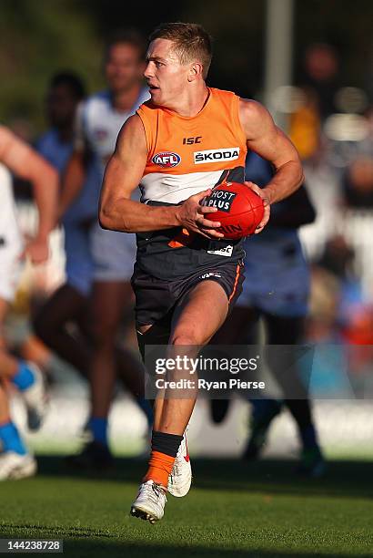 Devon Smith of the Giants looks upfield during the round seven AFL match between the Greater Western Sydney Giants and the Gold Coast Suns at Manuka...