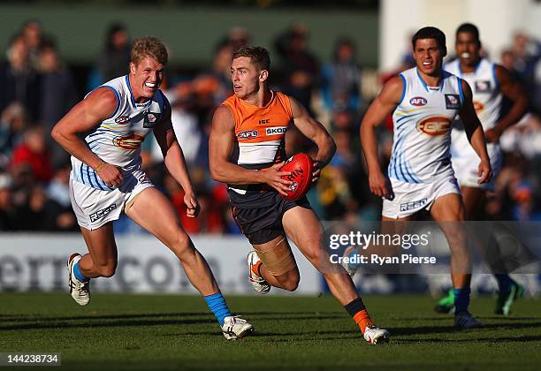 Devon Smith of the Giants looks upfield during the round seven AFL match between the Greater Western Sydney Giants and the Gold Coast Suns at Manuka...