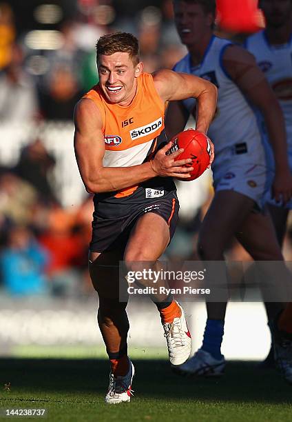 Devon Smith of the Giants looks upfield during the round seven AFL match between the Greater Western Sydney Giants and the Gold Coast Suns at Manuka...