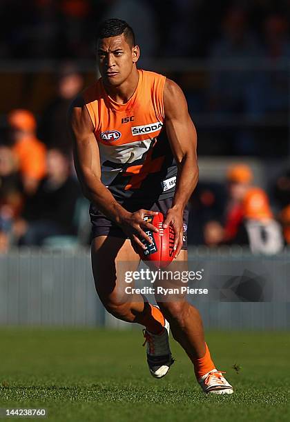 Israel Folau of the Giants looks upfield during the round seven AFL match between the Greater Western Sydney Giants and the Gold Coast Suns at Manuka...