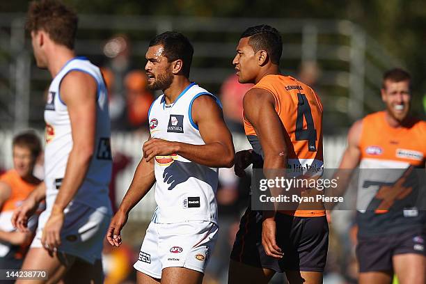 Israel Folau of the Giants and Karmichael Hunt of the Suns look on during the round seven AFL match between the Greater Western Sydney Giants and the...