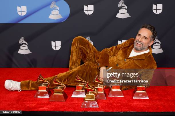 Jorge Drexler poses with the awards for Record of the Year, Best Pop Song, Best Alternative Song, Best Singer/Songwriter Album, Best Portuguese...