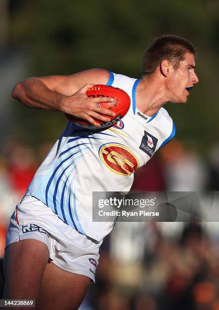 Zac Smith of the Suns looks upfield during the round seven AFL match between the Greater Western Sydney Giants and the Gold Coast Suns at Manuka Oval...