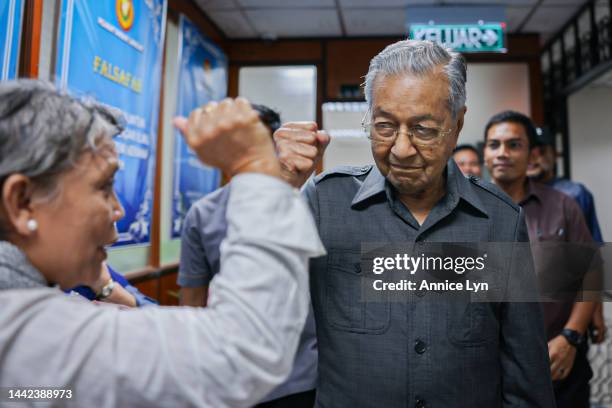 Former Malaysia Prime Minister and founder of the Gerakan Tanah Air coalition Mahathir Mohamad, gives a fist bump to a supporter at the nomination...