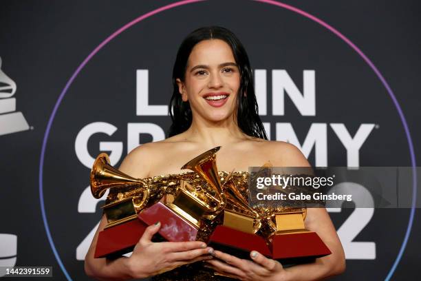 Rosalía poses with the awards for Best Recording Package, Album of the Year, and Best Alternative Music Album in the media center for The 23rd Annual...