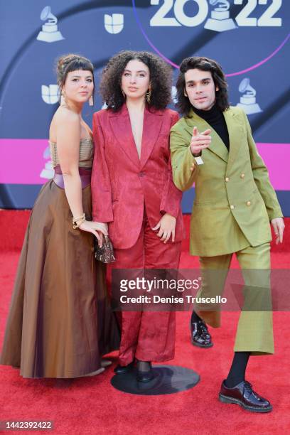 Julia Mestre, Dora Morelenbaum and Zé Ibarra of Bala Desejo attend The 23rd Annual Latin Grammy Awards at Michelob ULTRA Arena on November 17, 2022...