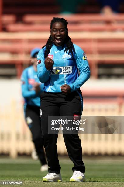 Deandra Dottin of the Strikers celebrates taking the wicket of Lizelle Lee of the Hurricanes during the Women's Big Bash League match between the...