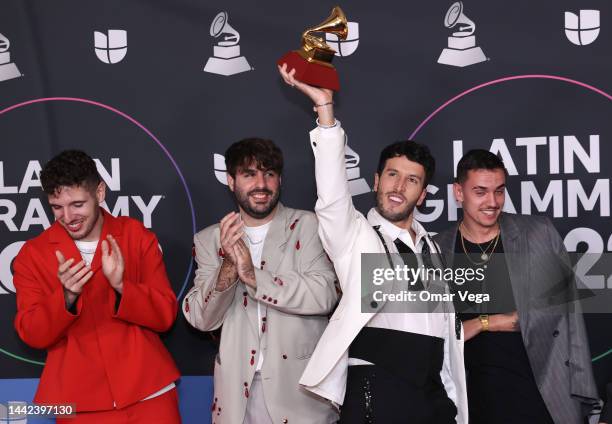 Manual Lara, Juanjo Monserrat, Sebastian Yatra and Manuel Lorente pose with the award for Best Pop Song for the song Tacones Rojos in the Media...