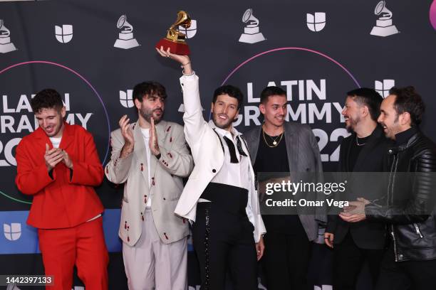 Manual Lara, Juanjo Monserrat, Sebastian Yatra and Manuel Lorente pose with the award for Best Pop Song for the song Tacones Rojos in the Media...