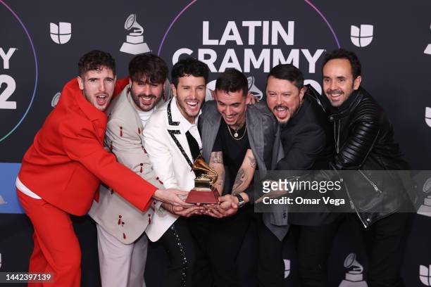 Manual Lara, Juanjo Monserrat, Sebastian Yatra and Manuel Lorente pose with the award for Best Pop Song for the song Tacones Rojos in the Media...