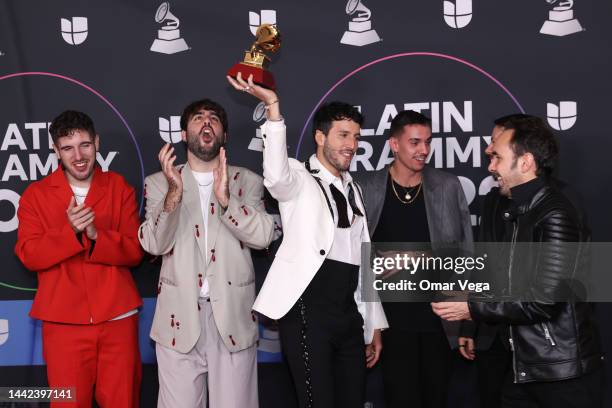 Manual Lara, Juanjo Monserrat, Sebastian Yatra and Manuel Lorente pose with the award for Best Pop Song for the song Tacones Rojos in the Media...