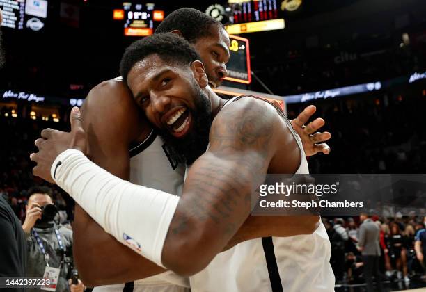 Royce O'Neale and Kevin Durant of the Brooklyn Nets celebrate after defeating the Portland Trail Blazers 109-107 at Moda Center on November 17, 2022...