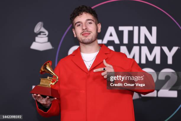 Juanjo Monserrat poses with the Best Pop Song award for Tacones Rojos in the media center for The 23rd Annual Latin Grammy Awards at the Mandalay Bay...