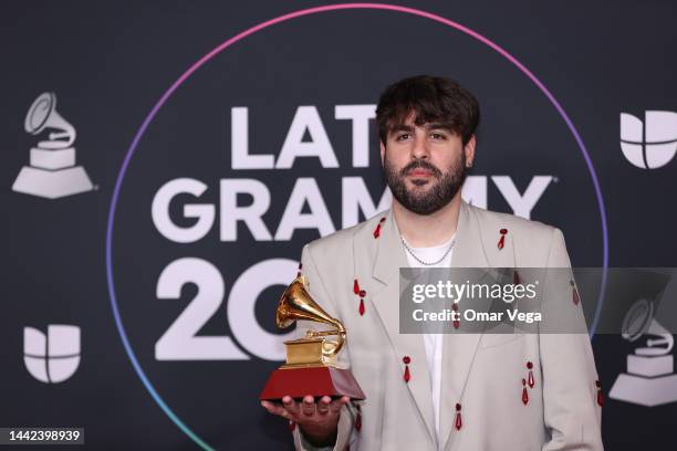 Manuel Lara poses with the Best Pop Song award for Tacones Rojos in the media center for The 23rd Annual Latin Grammy Awards at the Mandalay Bay...