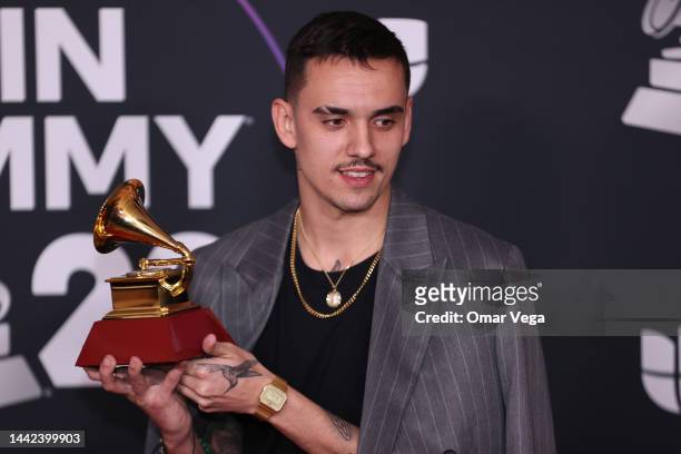 Manuel Lorente poses with the Best Pop Song award for Tacones Rojos in the media center for The 23rd Annual Latin Grammy Awards at the Mandalay Bay...