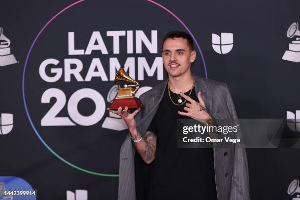 Manuel Lorente poses with the Best Pop Song award for Tacones Rojos in the media center for The 23rd Annual Latin Grammy Awards at the Mandalay Bay...
