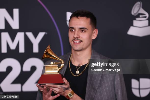 Manuel Lorente poses with the Best Pop Song award for Tacones Rojos in the media center for The 23rd Annual Latin Grammy Awards at the Mandalay Bay...