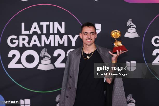 Manuel Lorente poses with the Best Pop Song award for Tacones Rojos in the media center for The 23rd Annual Latin Grammy Awards at the Mandalay Bay...