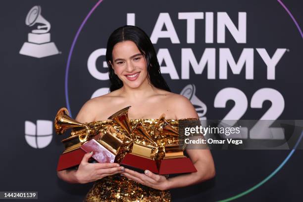 Rosalía poses with the awards for Best Recording Package, Album of the Year, and Best Alternative Music Album in the media center for The 23rd Annual...