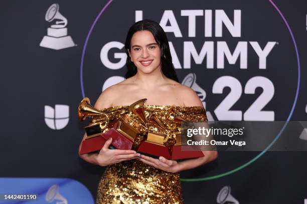 Rosalía poses with the awards for Best Recording Package, Album of the Year, and Best Alternative Music Album in the media center for The 23rd Annual...