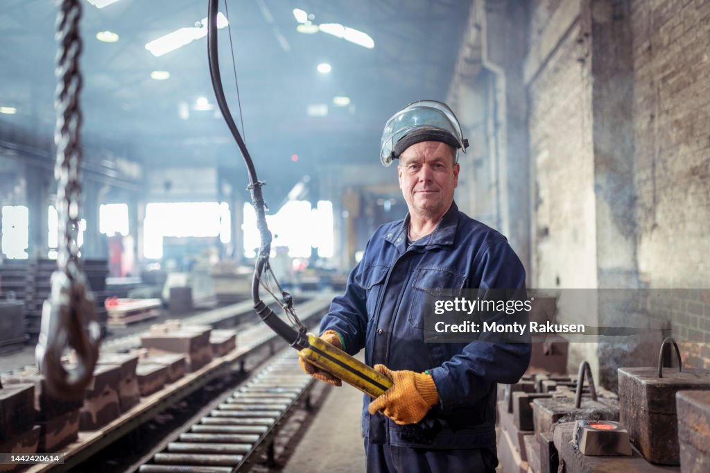 Portrait of iron foundry worker in iron foundry