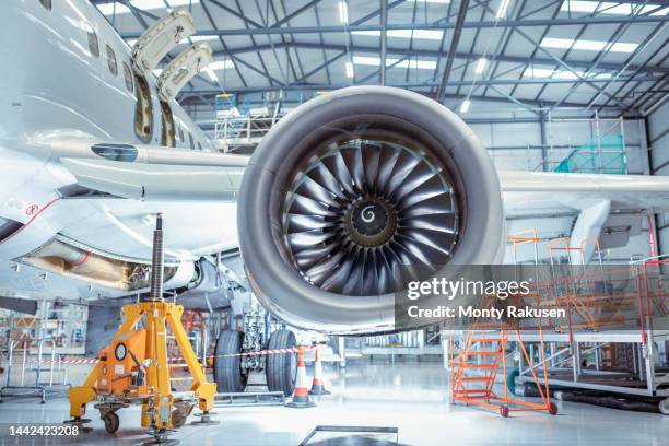 large jet engine in aircraft maintenance hangar - airline industry stock-fotos und bilder