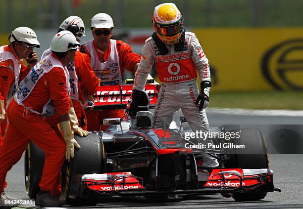 Lewis Hamilton of Great Britain and McLaren stops out on the track after finishing first during qualifying for the Spanish Formula One Grand Prix at...