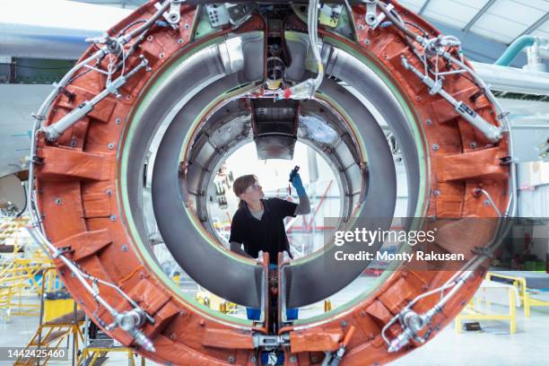 apprentice aircraft maintenance engineer inspecting jet engine - check engine light stock pictures, royalty-free photos & images