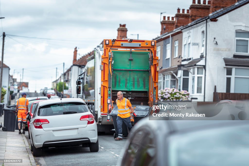 Refuse Stock Refuse Collectors And Refuse Truck In Street High-Res Stock Photo ...