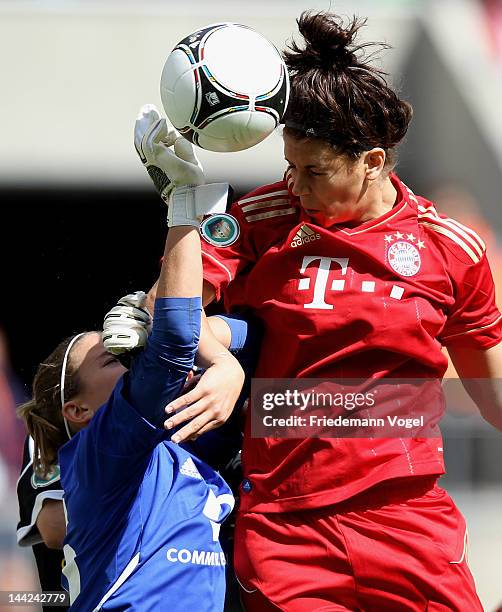 Desiree Schumann of Frankfurt and Radoslav Zabavnik of Bayern battle for the ball during the DFB Women's Cup final match between 1. FFC Frankfurt and...